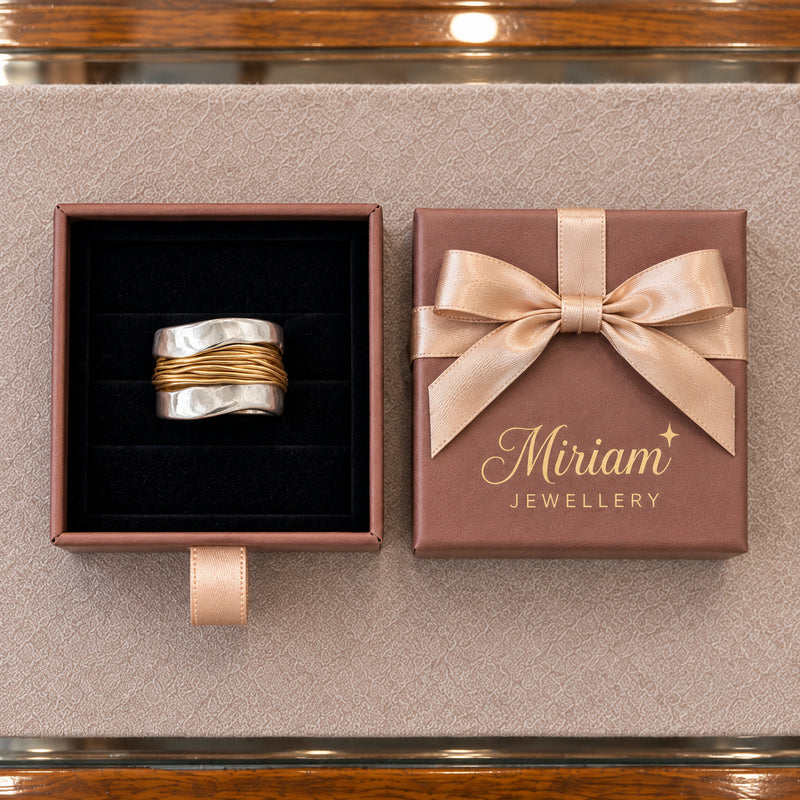 Silver ring with golden threads